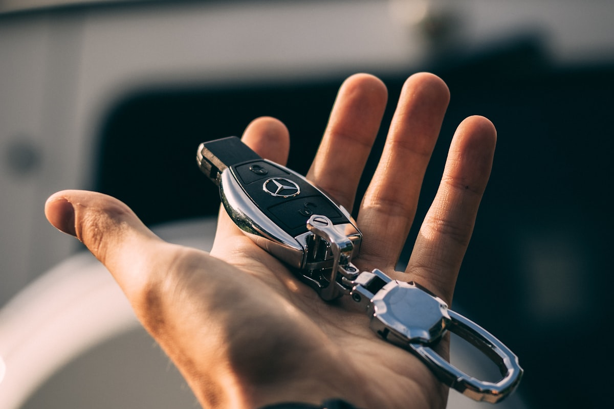 Car keys being handed over after a vehicle delivery